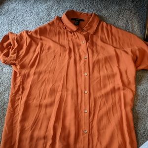 Pumpkin colored tunic length button down shirt